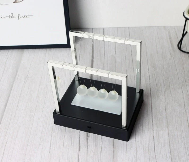 Newton’s Cradle LED Light-Up Kinetic Energy Toy – Home & Office Decor  لعبة نيوتن المضيئة بالطاقة الحركية – ديكور للمكتب والمنزل