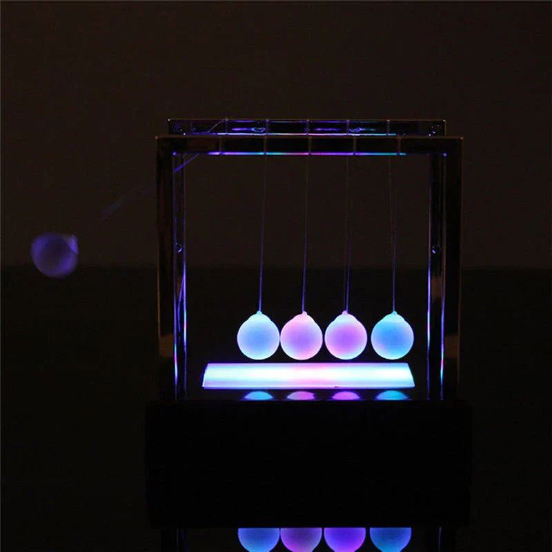 Newton’s Cradle LED Light-Up Kinetic Energy Toy – Home & Office Decor  لعبة نيوتن المضيئة بالطاقة الحركية – ديكور للمكتب والمنزل